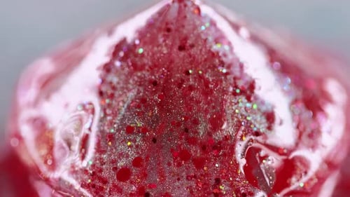 Red Slime Oozing with Glitter Macro Shot