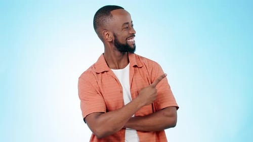 Face, happy man and pointing to advertising in studio of deal, information