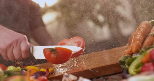 Cutting a red tomato