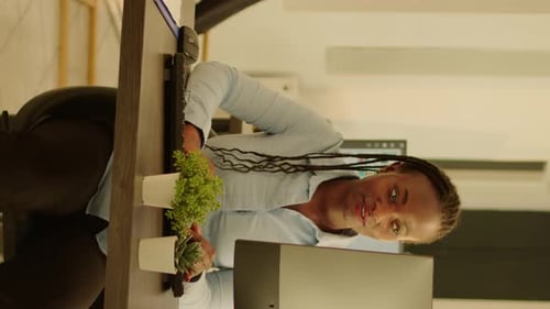 Vertical Video Startup Employee Working on Computer in Office with Big Windows