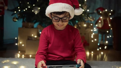 Excited Boy Plays Game at Christmas