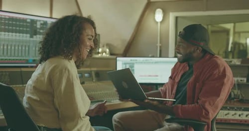 Producer and Singer Writing Song in Recording Music Studio