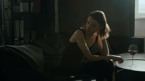 Anxious Girl Wearing Chemise Nervously Touching Knees, Head and Shoulders