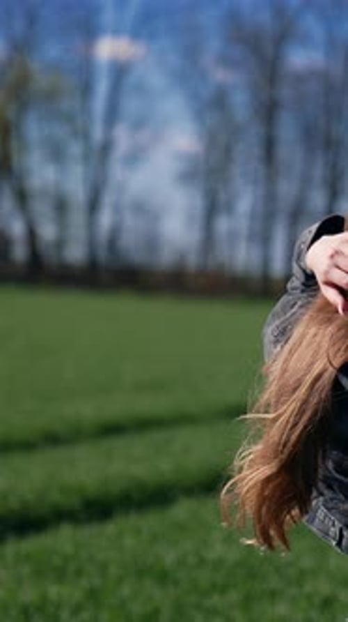 Young Woman Posing in Sunny Field