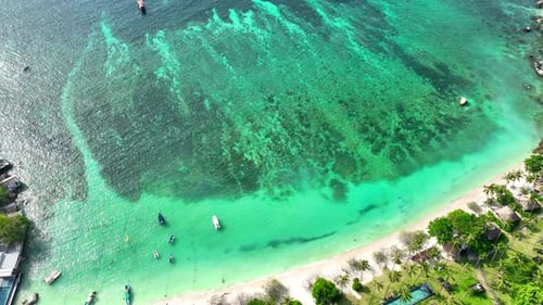 Sandy beach coastline in a tropical island in Thailand from aerial view.