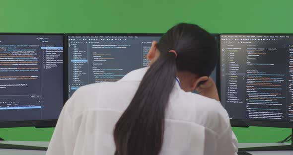 Woman Developer Having Headache While Write Code With Multiple Computer ...