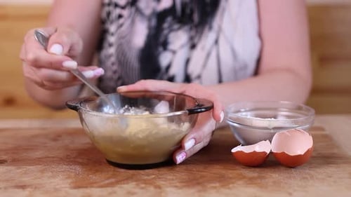 11 1Prepare the batter by adding milk, egg and flour. Preparing the dough for frying.
