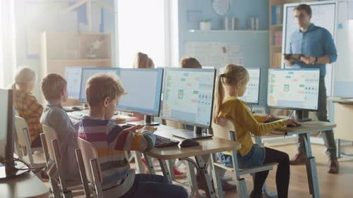 Elementary School Science Classroom: Teacher Educates Smart Little Schoolchildren who Work on Perso