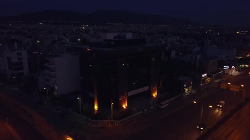 Aerial footage of dark Hellenic Olympic Committee building Athens Greece