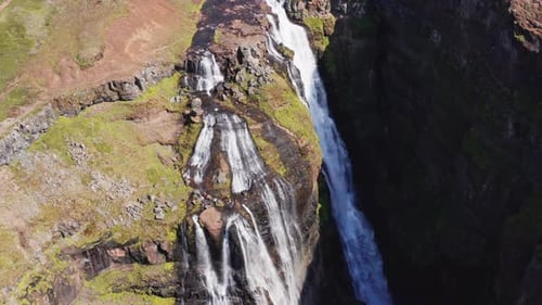 Aerial View of Majestic Glymur Waterfall In West Iceland on a Bright Sunny Day