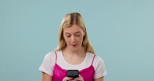 Blonde Woman Using Smartphone and Smiling