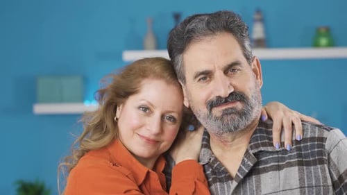 Loving Mature Couple Smiling Together Indoors