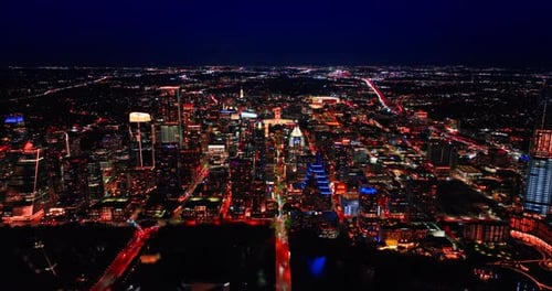 Breath-taking panorama of Austin, Texas, USA at night. Distancing from the dark Colorado River