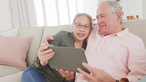 Senior Couple Using a Tablet at Home