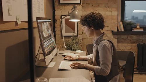 Female Colorist Editing Footage in Computer