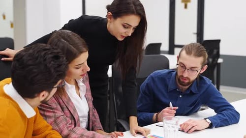 Office Employees Sit and Discuss on Startup Project in Conference Room with Charts Team of Business