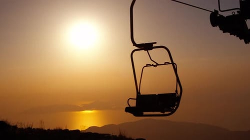 Ski Lift Silhouette in Tropical Sunset