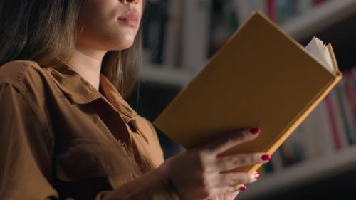 Smart Unrecognizable Young Woman Girl Female Student Reading Book in University Library Near