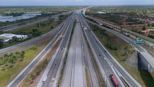 Highway in Miami City with the Fastmoving Vehicles Showing US Transportation Infrastructure Under a