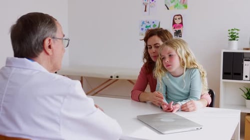Child Attends Doctor Appointment With Adult