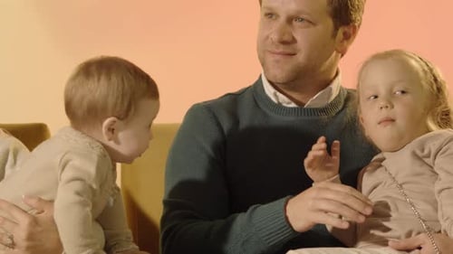 Man with Two Girls Sitting Together