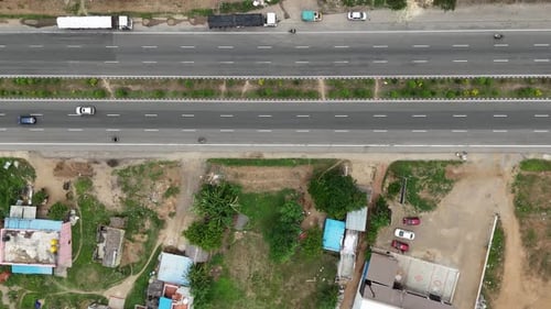 Highway footage with a focus on the adjacent service road, shows the local traffic and connectivity