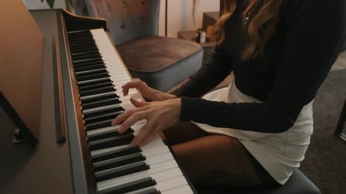 Woman Plays the Piano Indoors
