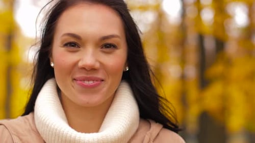 Smiling Woman Close Up in an Autumn Park