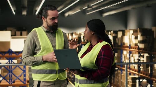 Diverse Team of Employees Laptop Tracking Software Logistics Center