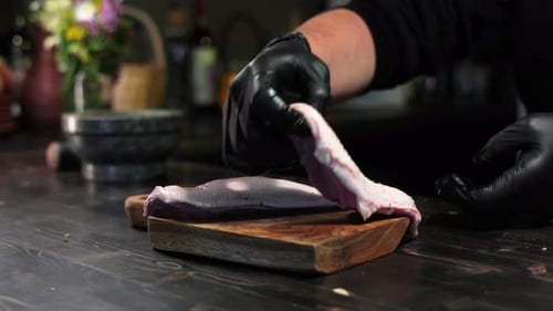 Male Chef Hands Putting Fresh Raw Meat Fillet Peace Serving on Wooden Board at Restaurant Kitchen