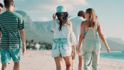 Friends, rear view or walking on beach for travel with bonding, discussion or wind for vacation