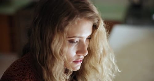 Woman's Portrait With Wavy Hair Looking Aside