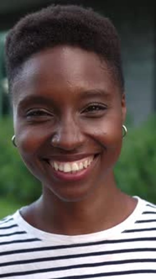 Close-up of Smiling Young Woman in Vertical Format