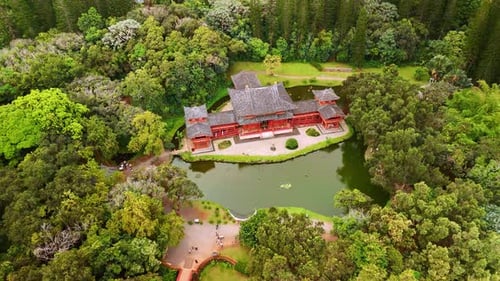 Rising over Byodo-In Temple at the foot of the Koolau Mountains