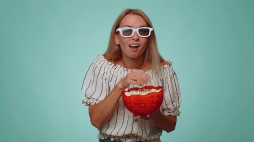Woman Eats Popcorn in 3D Glasses