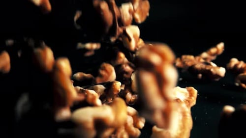 Shelled Walnuts Falling in Slow Motion