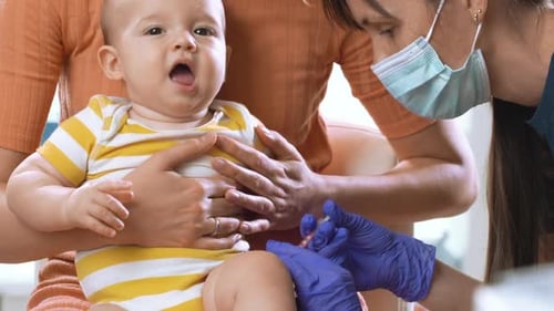 Baby Receives Vaccine in Doctor's Office