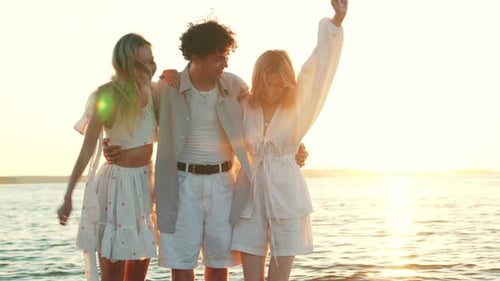 Man and two women at seaside