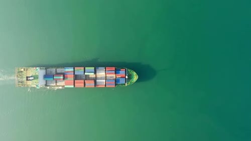 Aerial top view of cargo ship carrying container for import export goods send to customer from cargo
