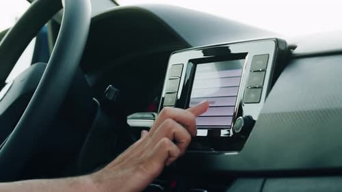 Man Driver Using Touchpad in Car Vehicle and Personal Transport Car Sharing Concept Guy Driving