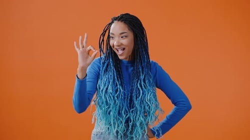 Smiling Woman Making OK Hand Gestures