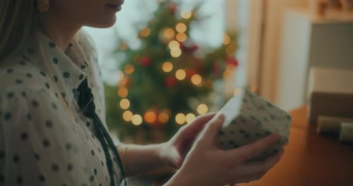Joyful Woman Decorating Wrapping Christmas Gifts For Xmas Holidays
