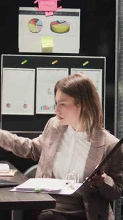 Woman Works with Data in Office Setting