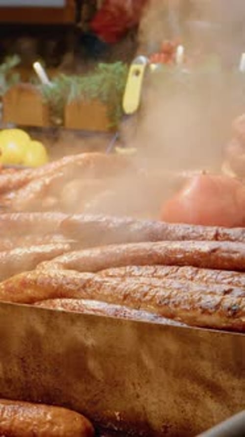Vertical video Delicious assorted sausages and meats in store window display for holidays