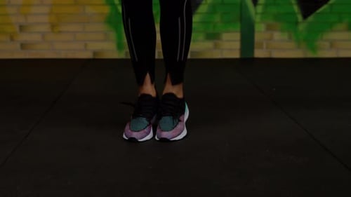 Woman trains and jumps rope, coordination training, crossfit training day in the gym, strength fit b