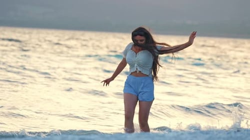 Happy Woman Walking Through Water