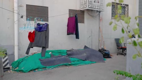 Locals dry their clothes on the streets in the hutongs. Life in the hutongs in Beijing, China on a w