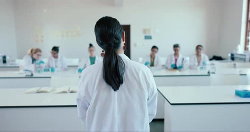 Classroom, professor and students with science, university and teaching with chemistry