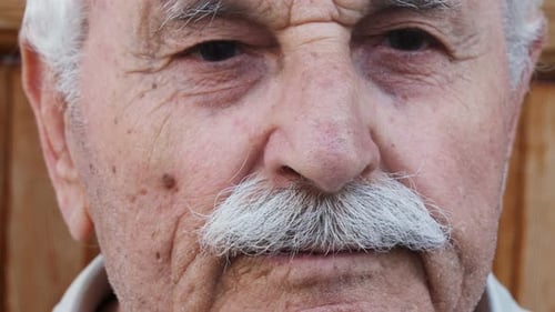 old man face,looking at the future. Close up on senior man's face