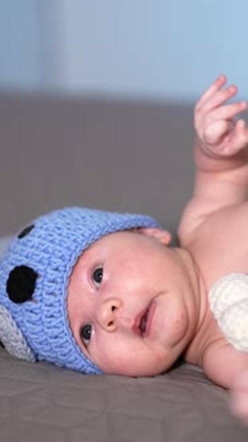 Adorable Infant Lying Down, Moving Limbs